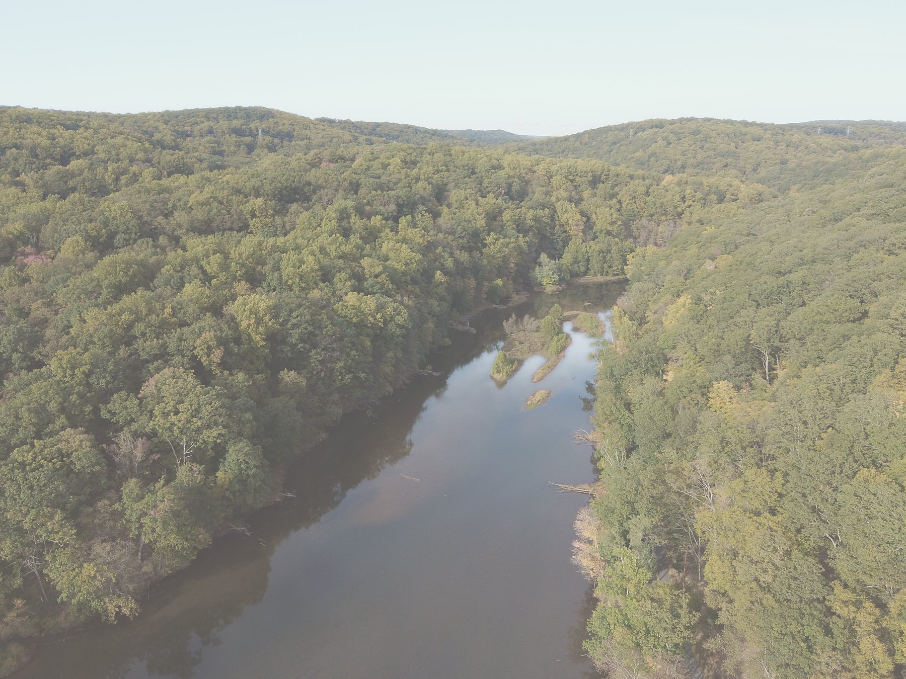 A river winding through wooded hills